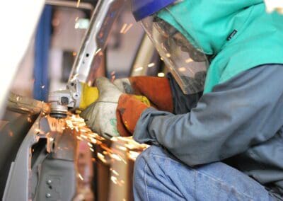 person is working on welding shed