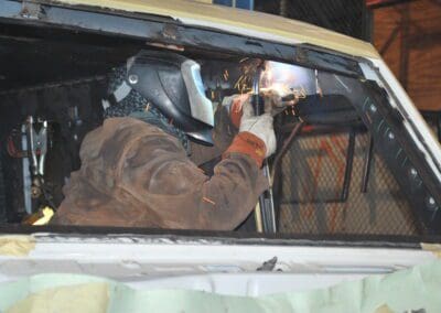 Welder working inside the car